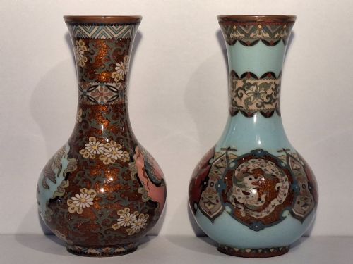 fig 3. A pair of Japanese Meiji period cloisonne enamel miniature vases featuring detailed dragon and phoenix medallions on brown and light blue grounds.