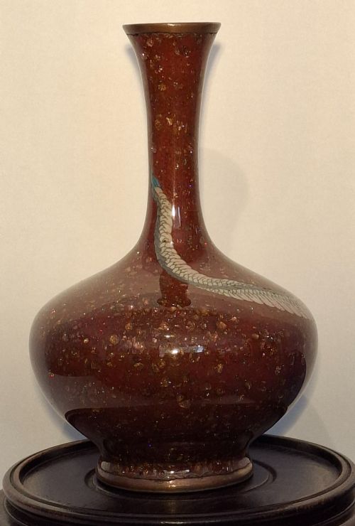 fig 2. A miniature dark red Japanese cloisonne enamel vase featuring a detailed coiled dragon motif and a slender neck.