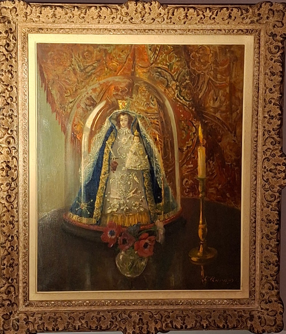 A framed 19th-century oil painting depicting a statue of the Madonna and Child beneath a glass cloche, flanked by a candle and a small vase of flowers.