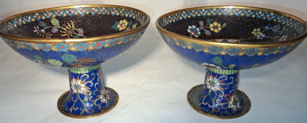 A pair of 19th-century Chinese cloisonne enamel tazzas featuring floral motifs, geometric fretwork patterns, and gilt metal rims. View III