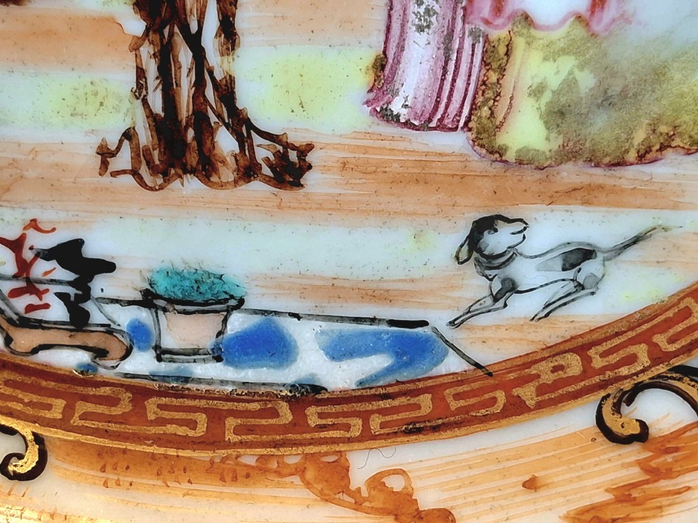 A set of four circular Chinese export porcelain saucers hand-painted with figural scenes inside pavilions framed by geometric borders in orange and polychrome enamels. View XIV