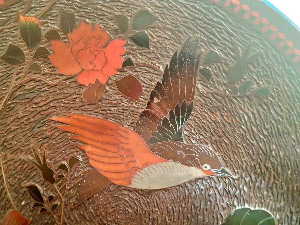 A pair of circular Japanese Totai Shippo porcelain plates depicting birds, lotus flowers, and peonies in polychrome enamel against a textured brown tree bark effect ground. View III
