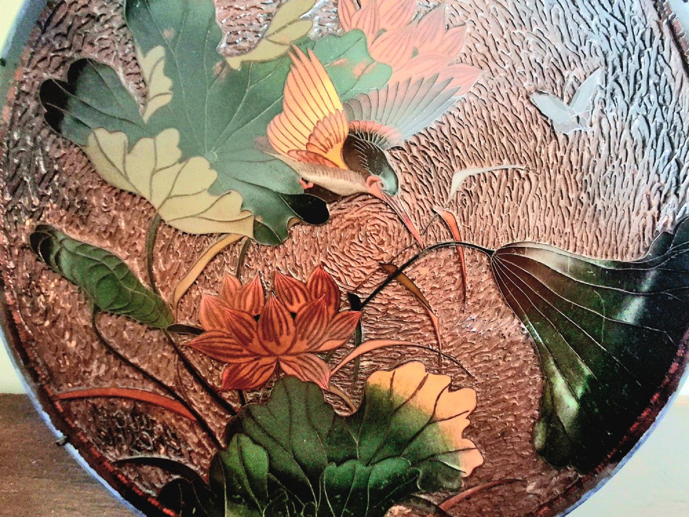 A pair of circular Japanese Totai Shippo porcelain plates depicting birds, lotus flowers, and peonies in polychrome enamel against a textured brown tree bark effect ground. View VI