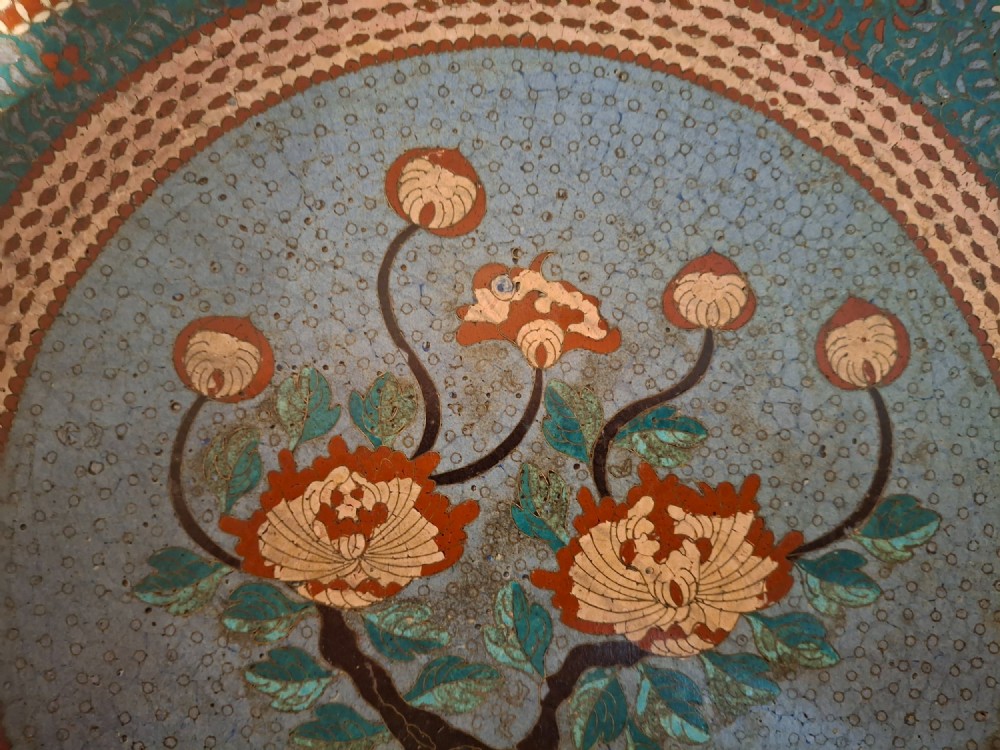 Large circular antique Japanese cloisonne enamel charger featuring a central peony motif surrounded by intricate geometric and floral diaper patterns in teal, blue, and coral hues. View III