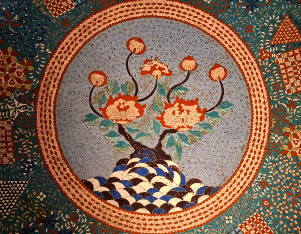 Large circular antique Japanese cloisonne enamel charger featuring a central peony motif surrounded by intricate geometric and floral diaper patterns in teal, blue, and coral hues. View IV