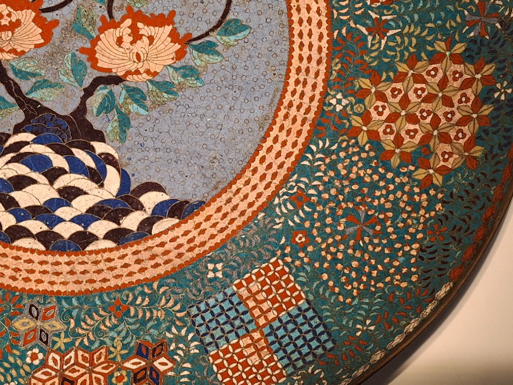 Large circular antique Japanese cloisonne enamel charger featuring a central peony motif surrounded by intricate geometric and floral diaper patterns in teal, blue, and coral hues. View VIII