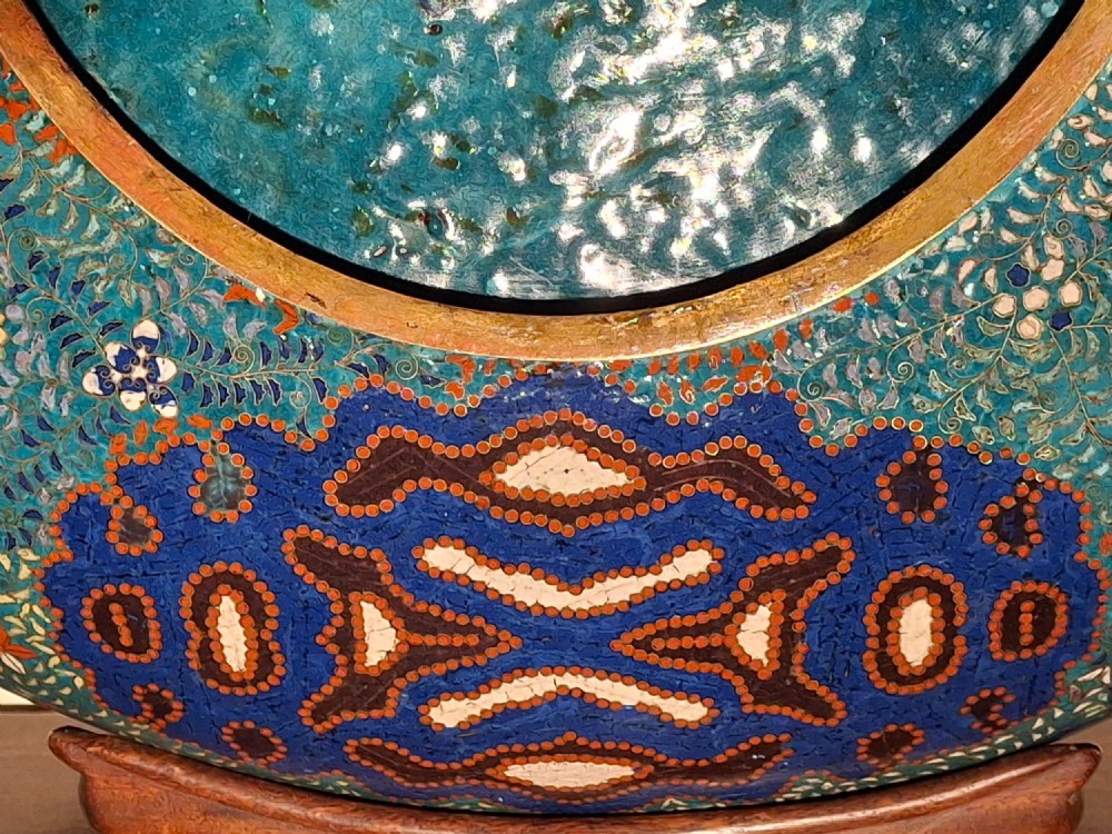 Large circular antique Japanese cloisonne enamel charger featuring a central peony motif surrounded by intricate geometric and floral diaper patterns in teal, blue, and coral hues. View XI