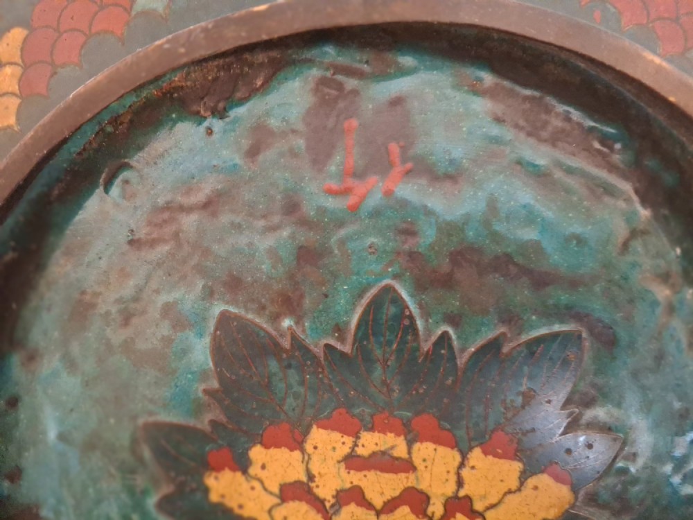 A circular Japanese Meiji period cloisonne enamel charger featuring a green and terracotta coiling dragon surrounding a flaming pearl on a dark blue background. View XV