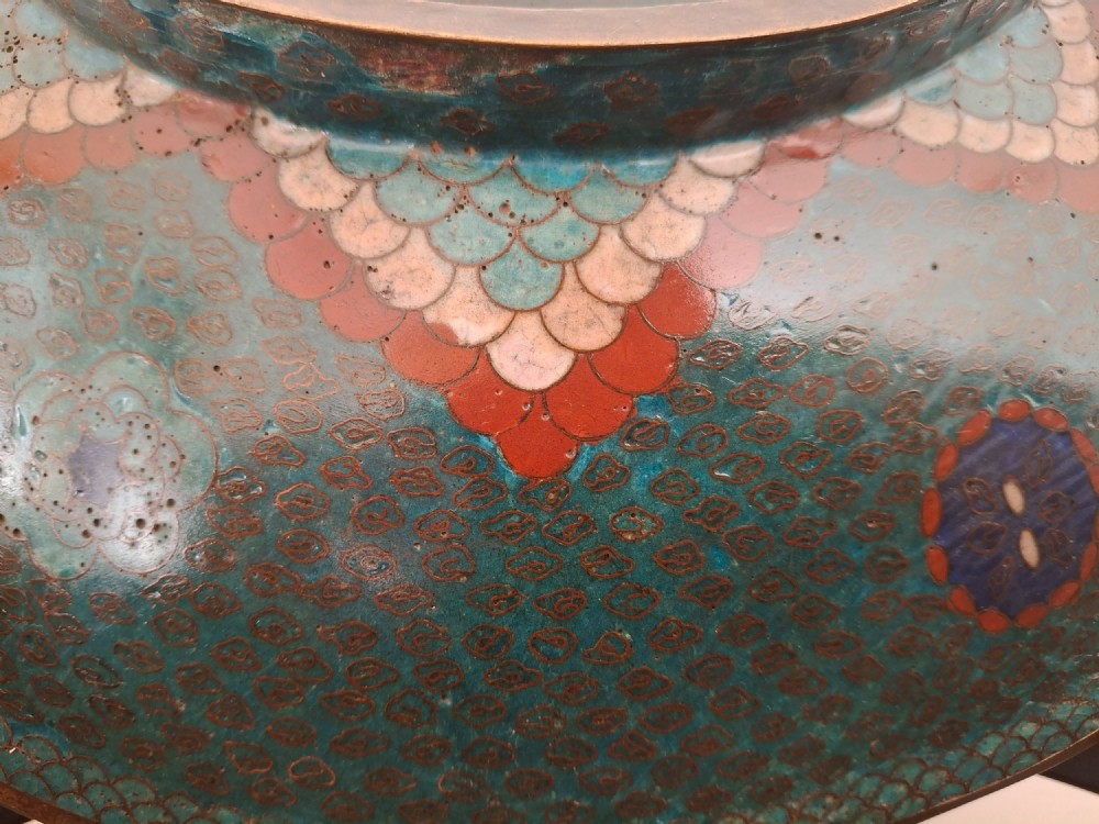 A circular antique Japanese cloisonne charger featuring a central bird motif surrounded by large orange peony blossoms on a green patterned enamel ground. View XIV