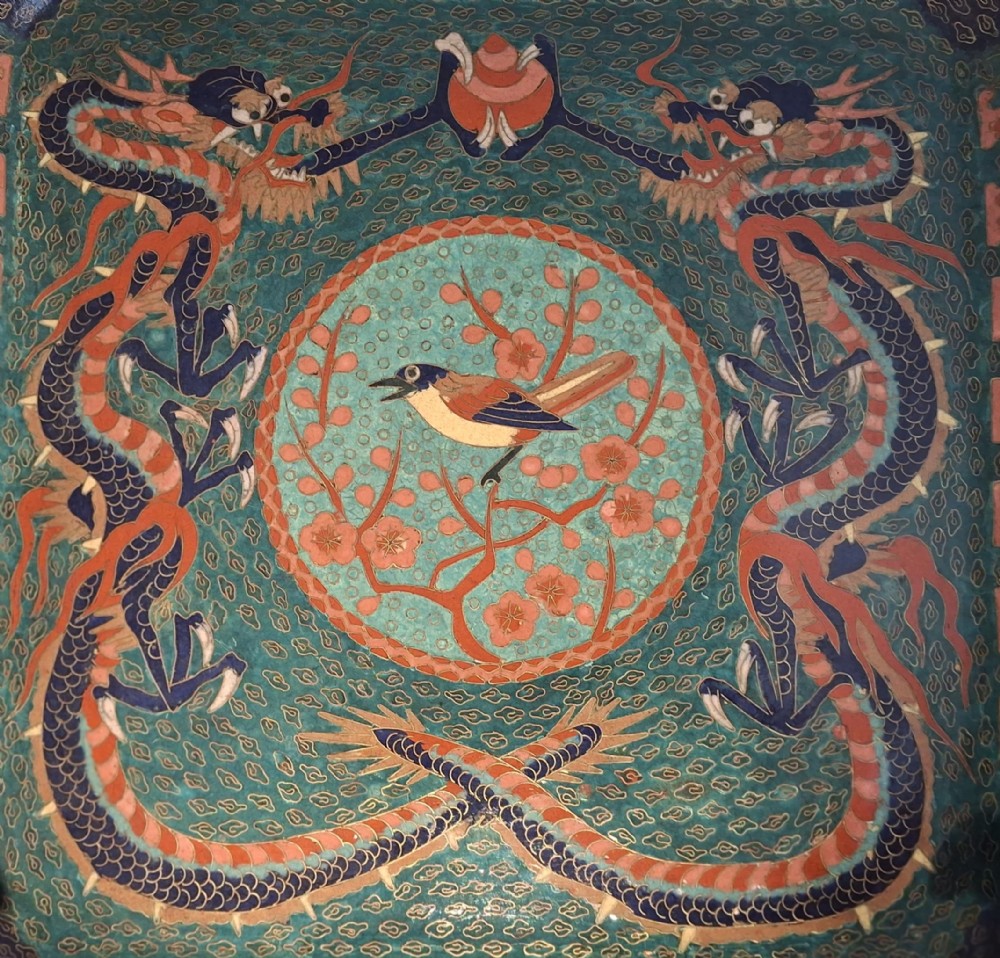 Square Japanese cloisonne enamel tray featuring a central bird motif surrounded by two coiled dragons on a teal patterned ground. View II
