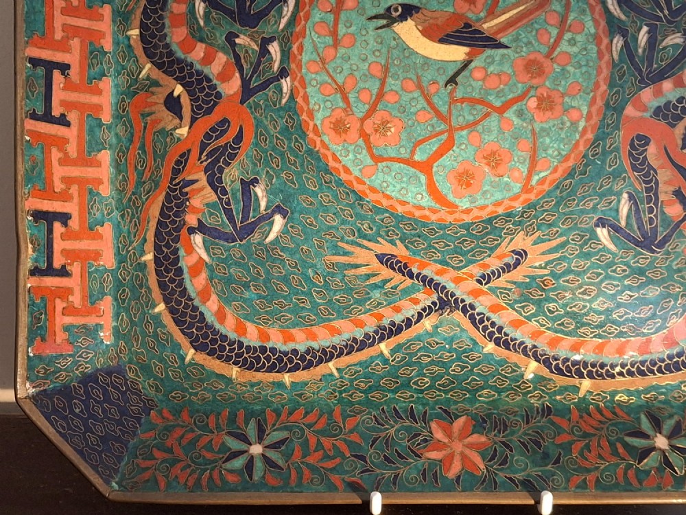 Square Japanese cloisonne enamel tray featuring a central bird motif surrounded by two coiled dragons on a teal patterned ground. View VII