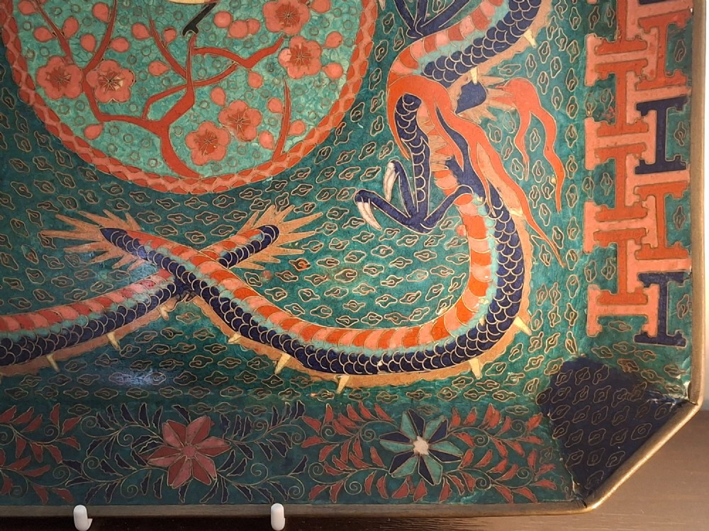 Square Japanese cloisonne enamel tray featuring a central bird motif surrounded by two coiled dragons on a teal patterned ground. View VIII