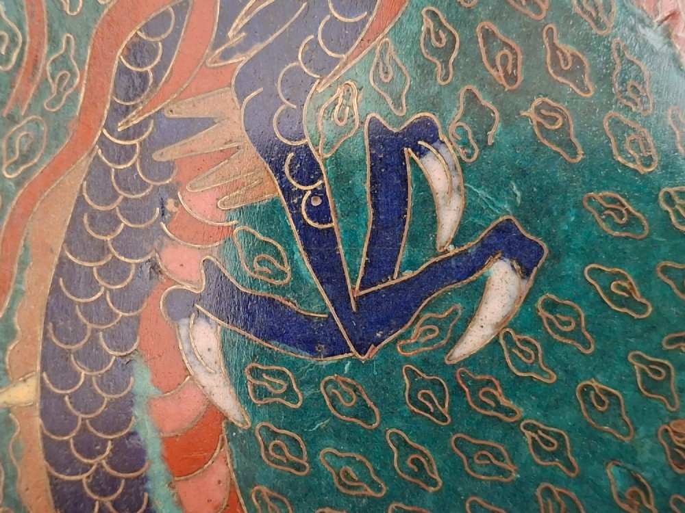 Square Japanese cloisonne enamel tray featuring a central bird motif surrounded by two coiled dragons on a teal patterned ground. View IX