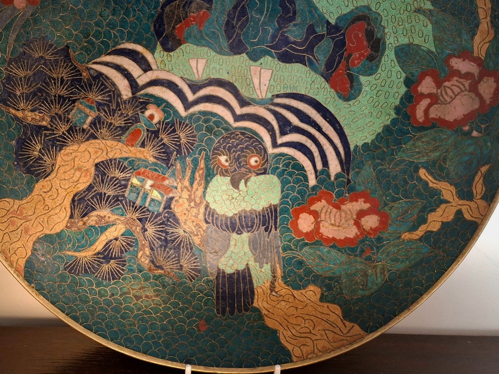 A circular Japanese cloisonne enamel charger featuring an owl, a flying bird, wave patterns, and Mount Fuji against a green ground. View II