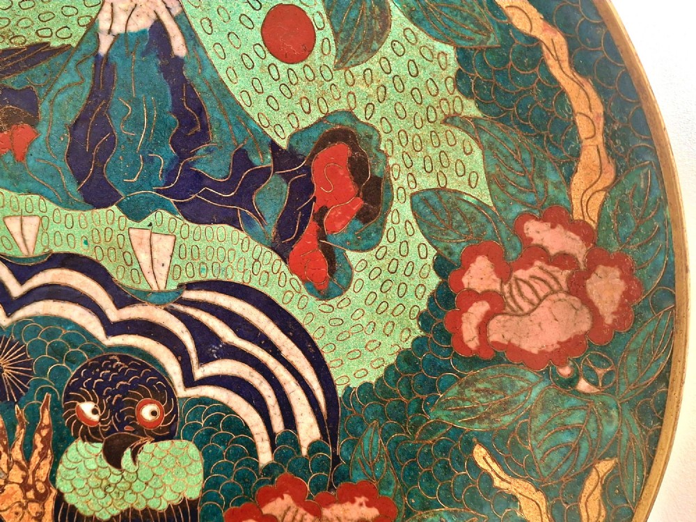 A circular Japanese cloisonne enamel charger featuring an owl, a flying bird, wave patterns, and Mount Fuji against a green ground. View III