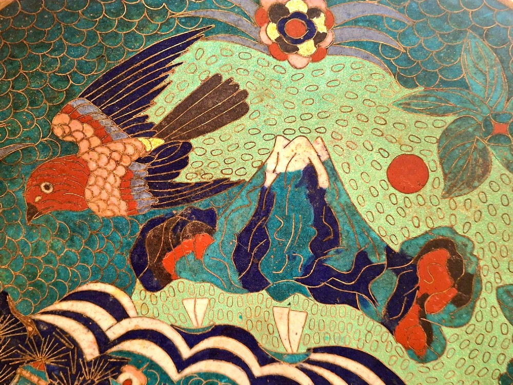 A circular Japanese cloisonne enamel charger featuring an owl, a flying bird, wave patterns, and Mount Fuji against a green ground. View IV