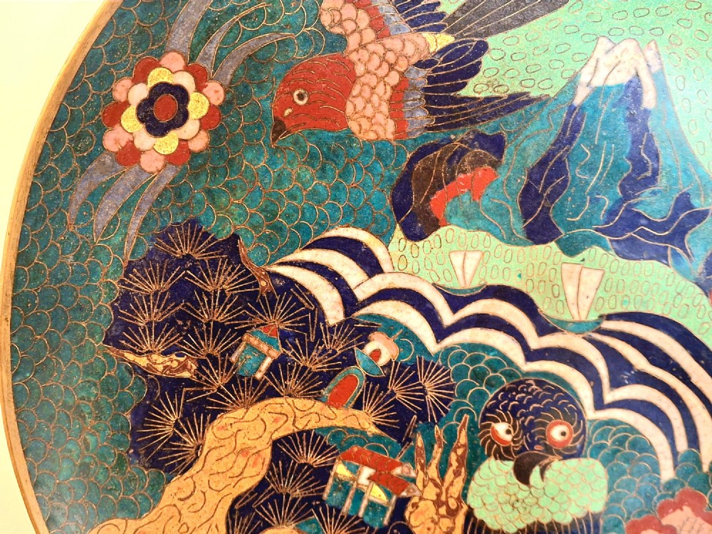 A circular Japanese cloisonne enamel charger featuring an owl, a flying bird, wave patterns, and Mount Fuji against a green ground. View V