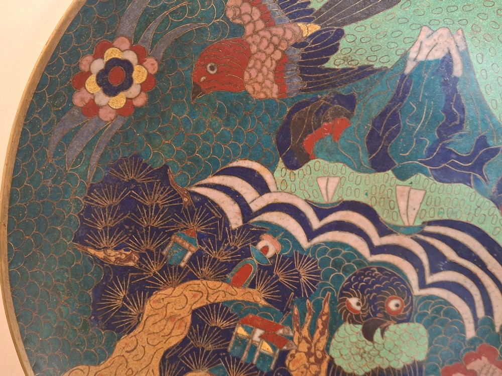 A circular Japanese cloisonne enamel charger featuring an owl, a flying bird, wave patterns, and Mount Fuji against a green ground. View VI