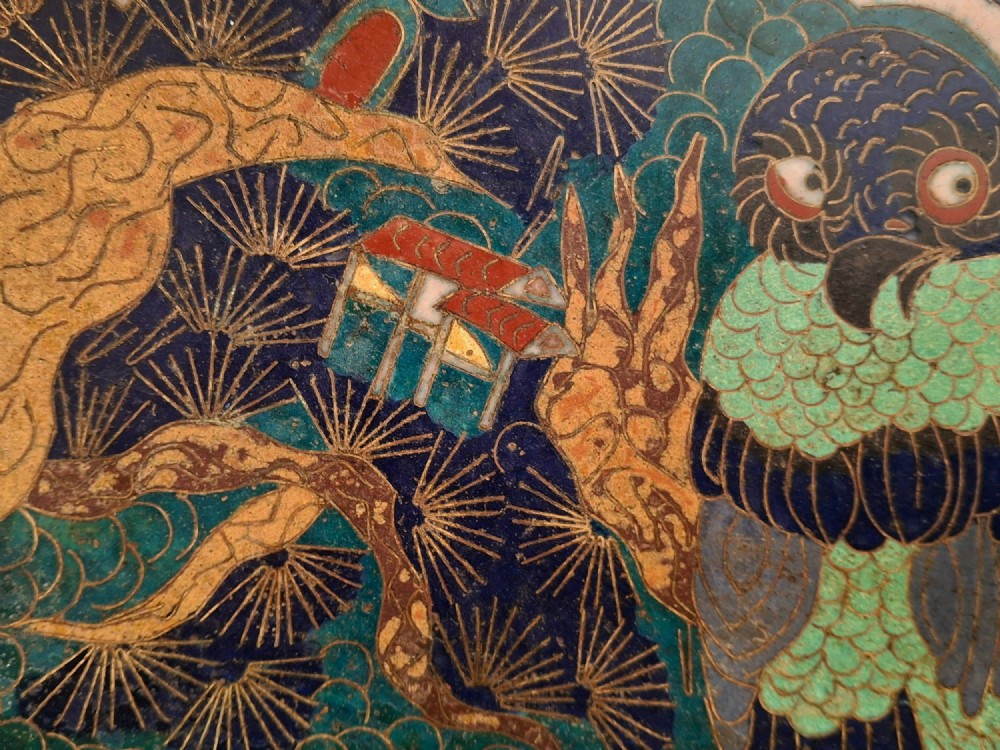 A circular Japanese cloisonne enamel charger featuring an owl, a flying bird, wave patterns, and Mount Fuji against a green ground. View X