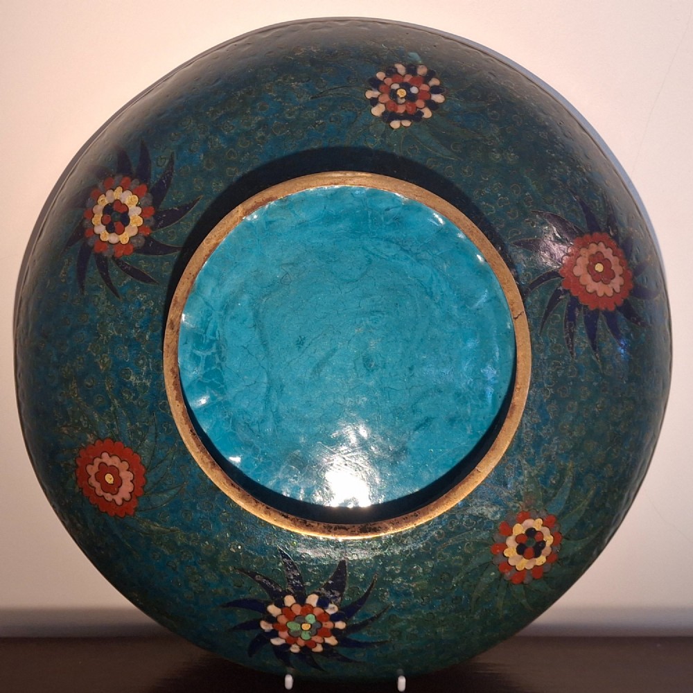 A circular Japanese cloisonne enamel charger featuring an owl, a flying bird, wave patterns, and Mount Fuji against a green ground. View XIV