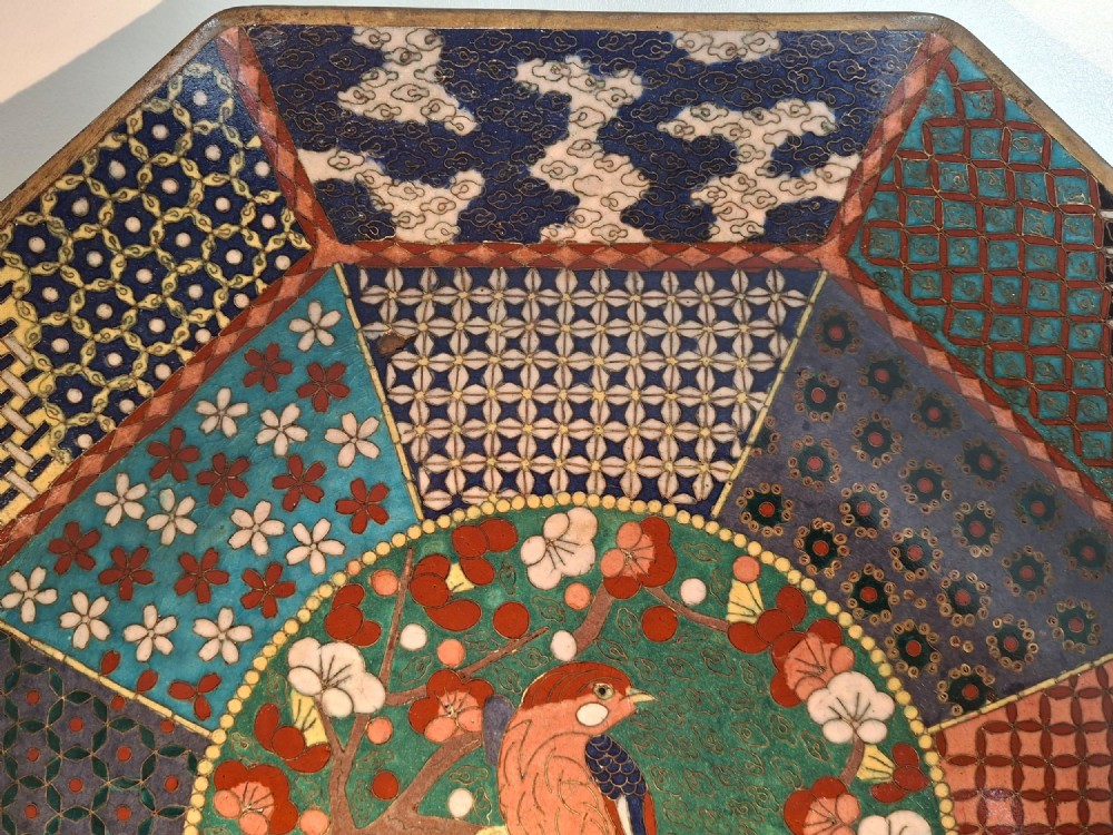 An octagonal antique Japanese cloisonne enamel tray featuring a central bird on a flowering branch surrounded by colourful geometric brocade panels. View III