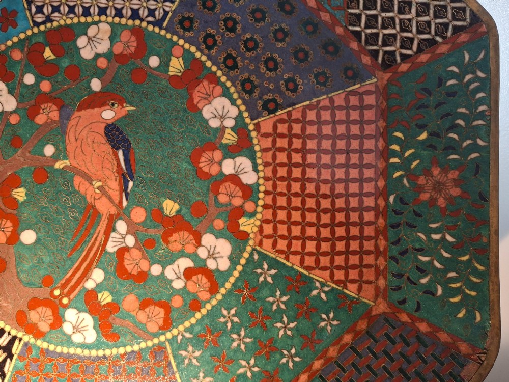 An octagonal antique Japanese cloisonne enamel tray featuring a central bird on a flowering branch surrounded by colourful geometric brocade panels. View IV