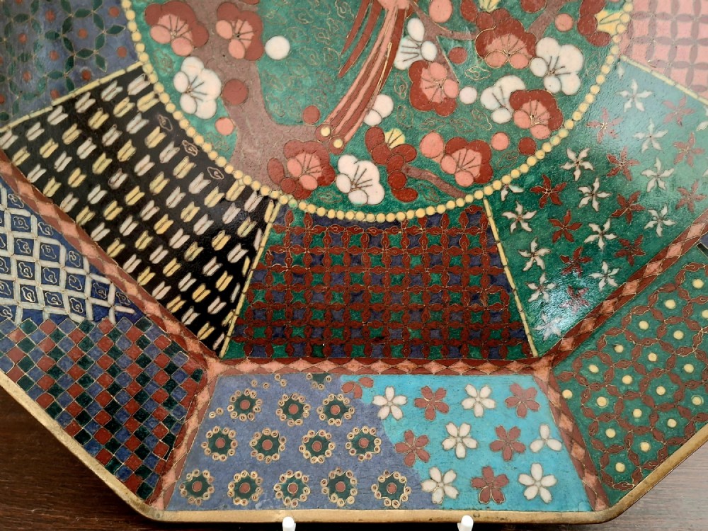 An octagonal antique Japanese cloisonne enamel tray featuring a central bird on a flowering branch surrounded by colourful geometric brocade panels. View VI