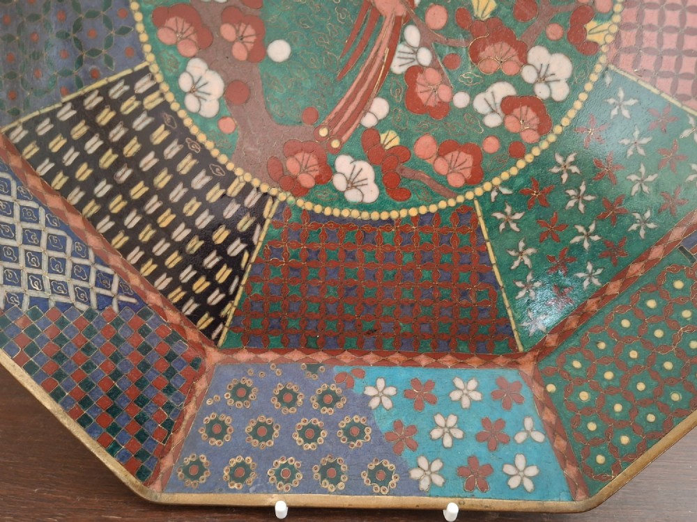 An octagonal antique Japanese cloisonne enamel tray featuring a central bird on a flowering branch surrounded by colourful geometric brocade panels. View VII