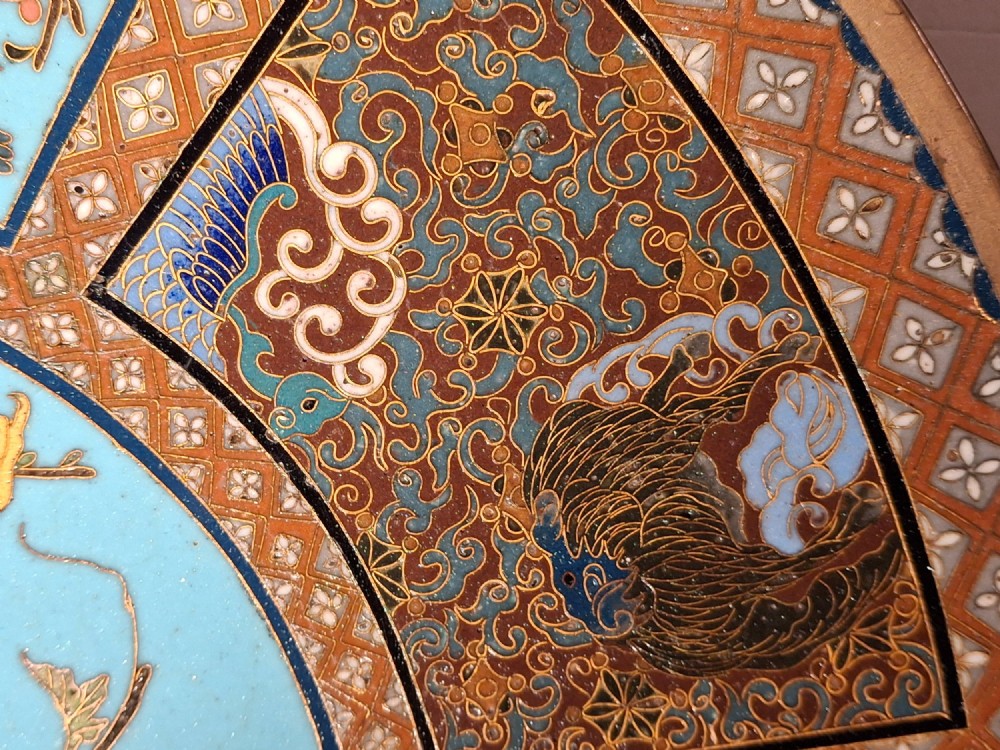 A circular Japanese cloisonne enamel charger featuring a central turquoise medallion with a floral vase and birds, enclosed by patterned borders and surrounding nature panels. View VII
