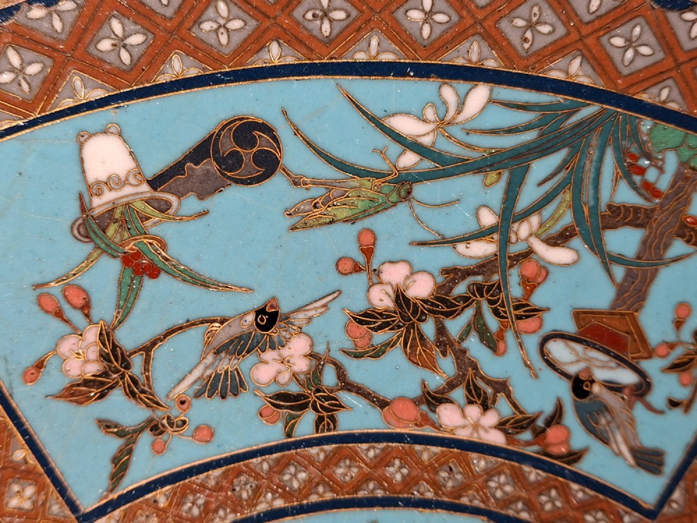 A circular Japanese cloisonne enamel charger featuring a central turquoise medallion with a floral vase and birds, enclosed by patterned borders and surrounding nature panels. View VIII