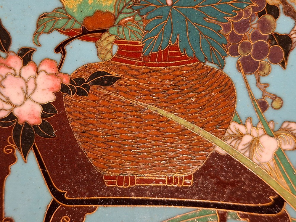 A circular Japanese cloisonne enamel charger featuring a central turquoise medallion with a floral vase and birds, enclosed by patterned borders and surrounding nature panels. View XI