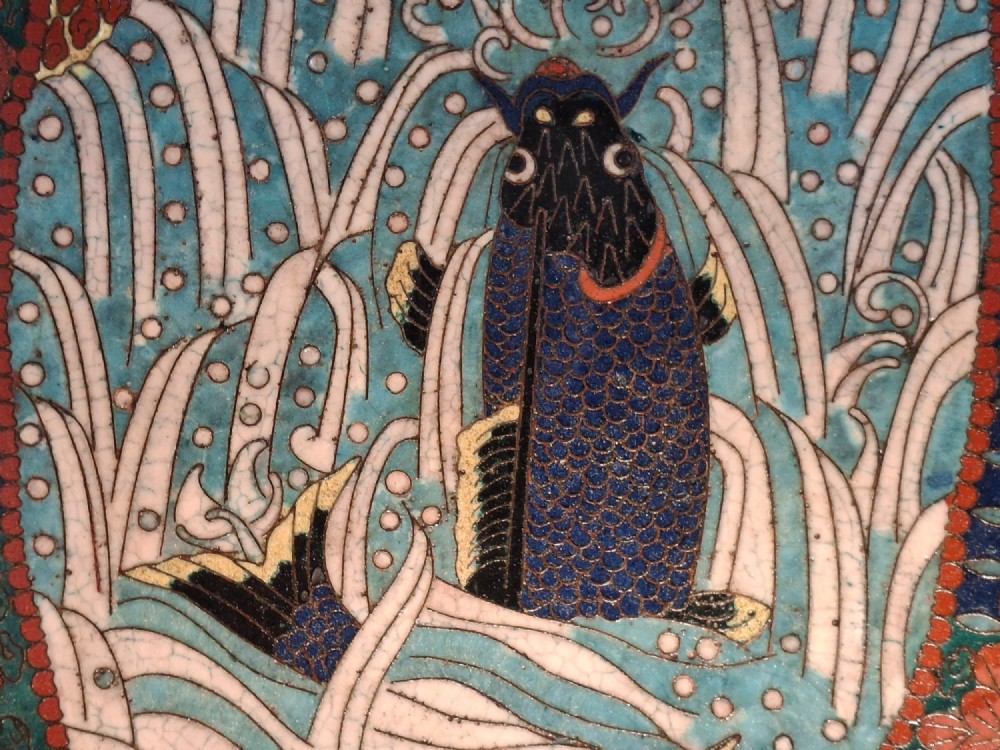 An oval Japanese cloisonne enamel tray displaying a central blue leaping koi carp within stylized waves, surrounded by geometric and red floral patterned borders. View II