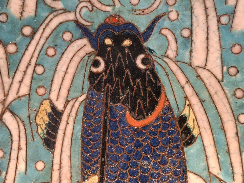 An oval Japanese cloisonne enamel tray displaying a central blue leaping koi carp within stylized waves, surrounded by geometric and red floral patterned borders. View III