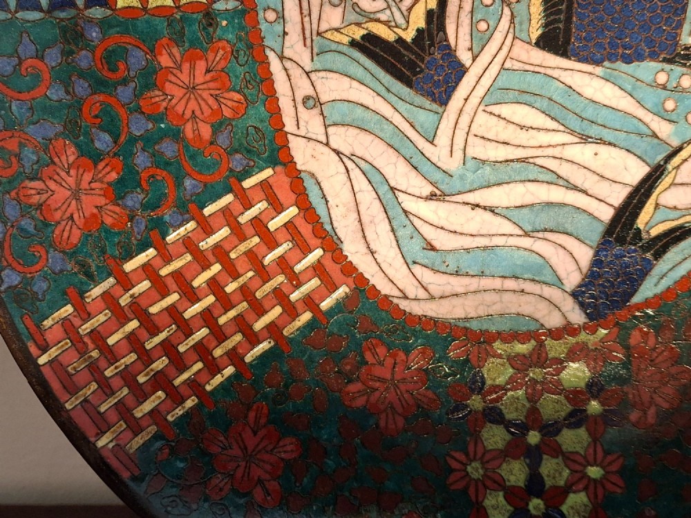 An oval Japanese cloisonne enamel tray displaying a central blue leaping koi carp within stylized waves, surrounded by geometric and red floral patterned borders. View V