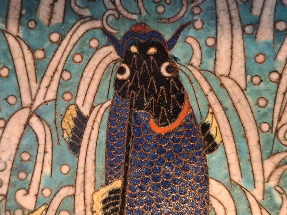 An oval Japanese cloisonne enamel tray displaying a central blue leaping koi carp within stylized waves, surrounded by geometric and red floral patterned borders. View VI