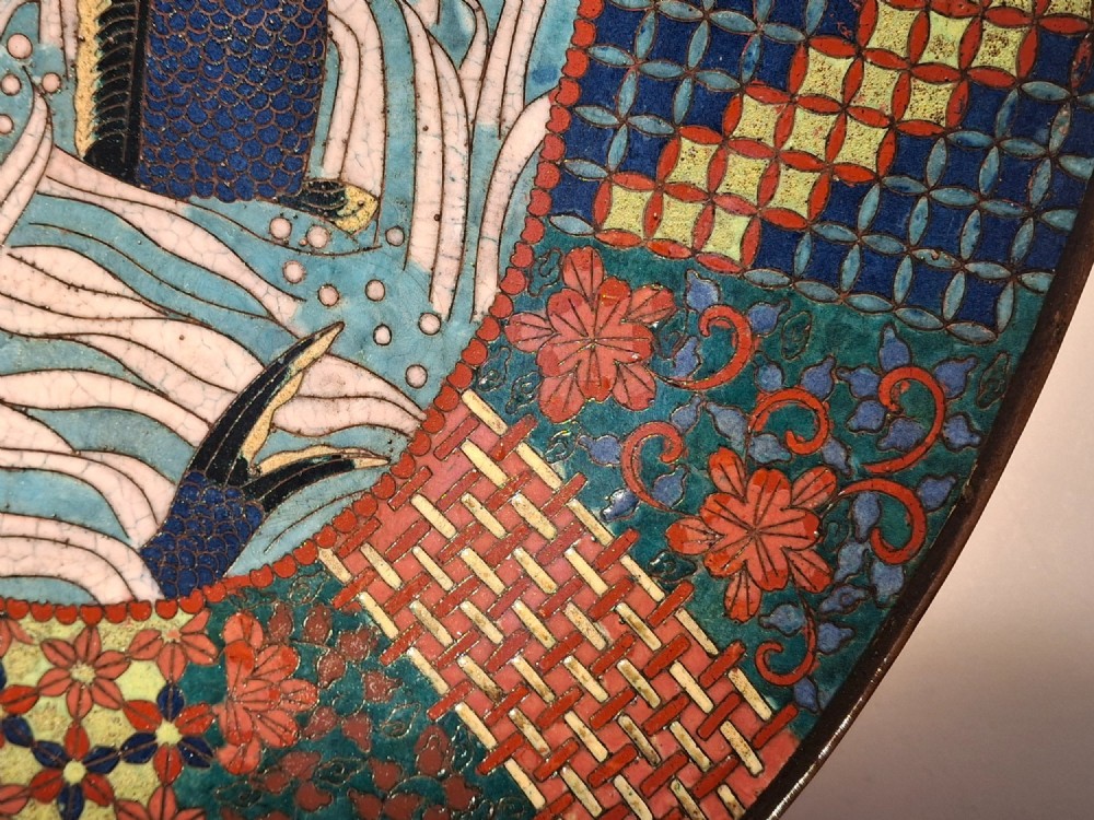 An oval Japanese cloisonne enamel tray displaying a central blue leaping koi carp within stylized waves, surrounded by geometric and red floral patterned borders. View VII