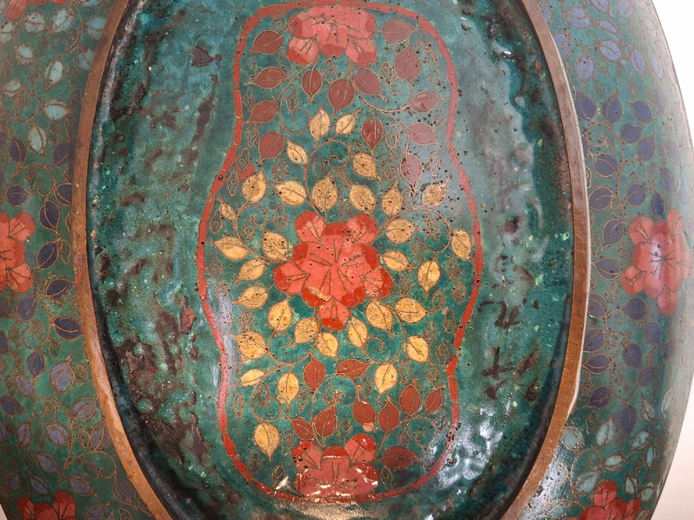 An oval Japanese cloisonne enamel tray displaying a central blue leaping koi carp within stylized waves, surrounded by geometric and red floral patterned borders. View XIII