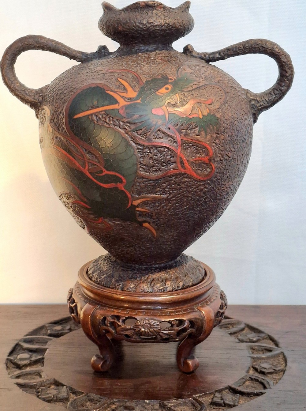 A nineteenth-century Japanese Totai Shippo ceramic vase featuring a textured tree-bark ground decorated with a dragon motif and twin handles.