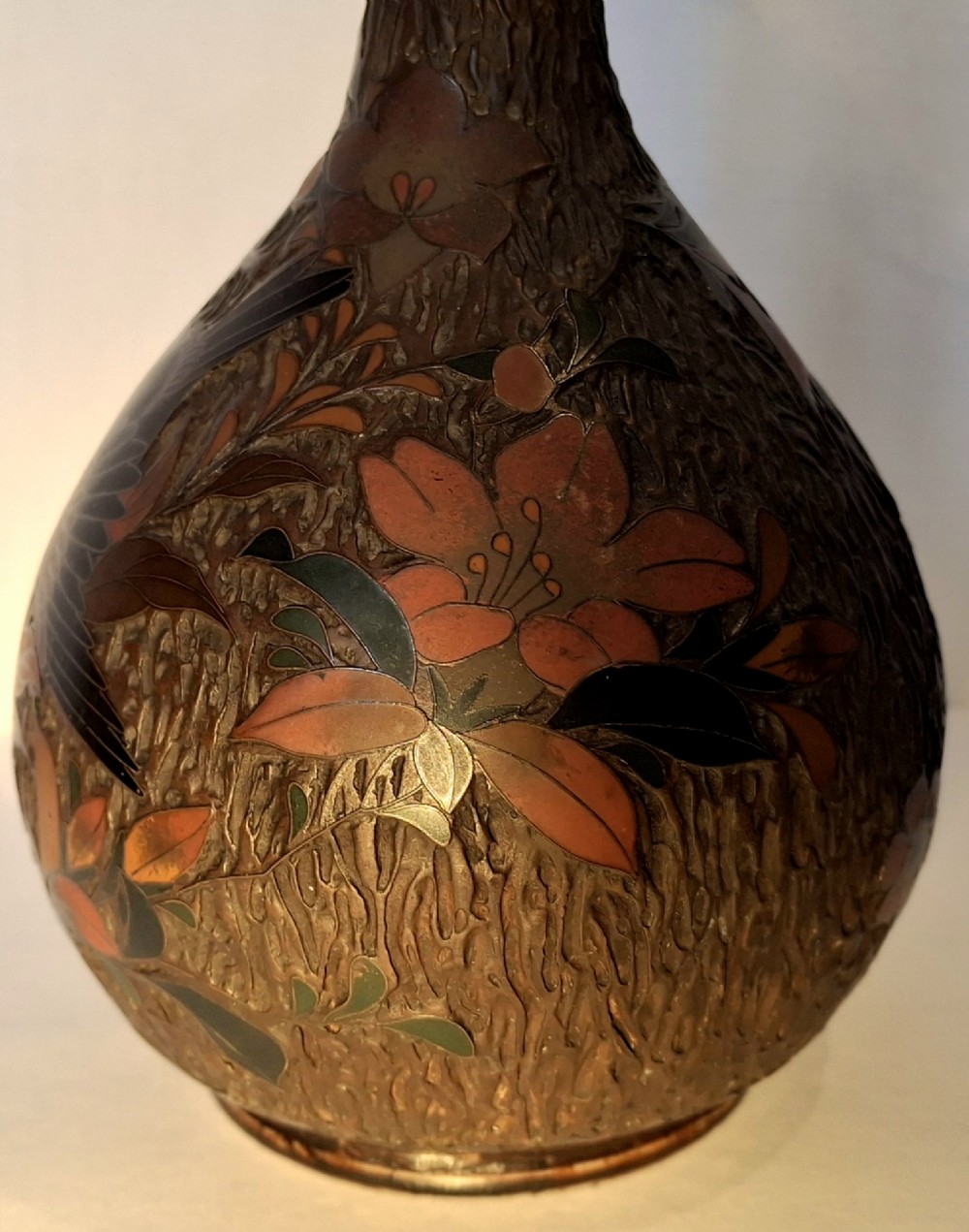 A pair of Japanese Totai Shippo ceramic vases featuring dark brown tree-bark textured surfaces decorated with cloisonne birds and foliage. View VII