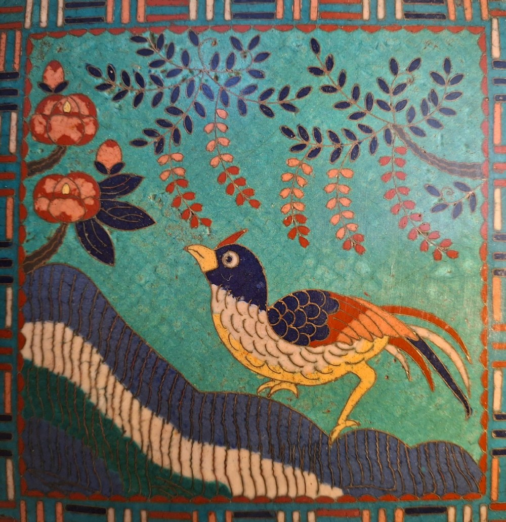 A square Japanese cloisonne enamel tray featuring a central panel with a bird and floral blossoms surrounded by turquoise geometric lattice borders. View VIII
