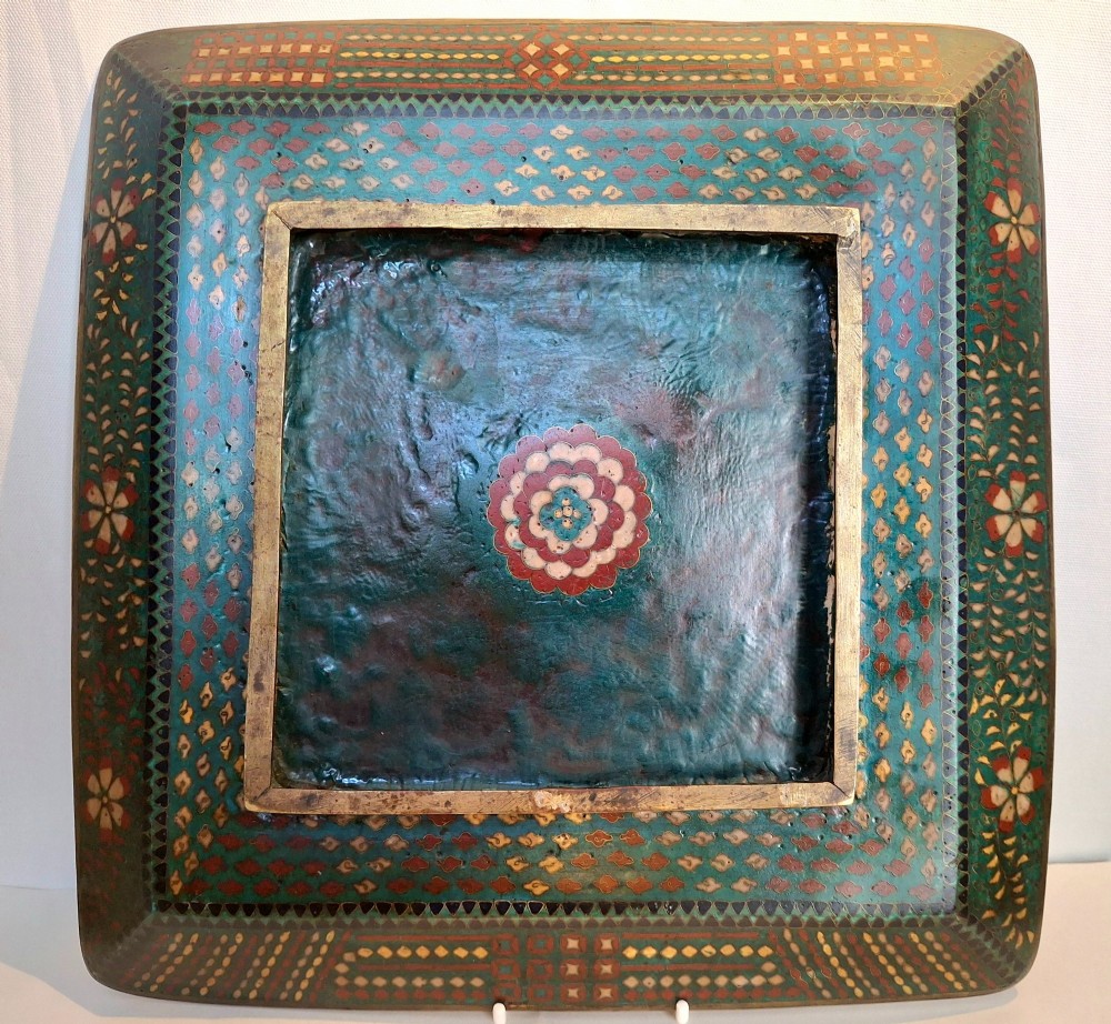A square Japanese cloisonne enamel tray featuring a central panel with a bird and floral blossoms surrounded by turquoise geometric lattice borders. View XI