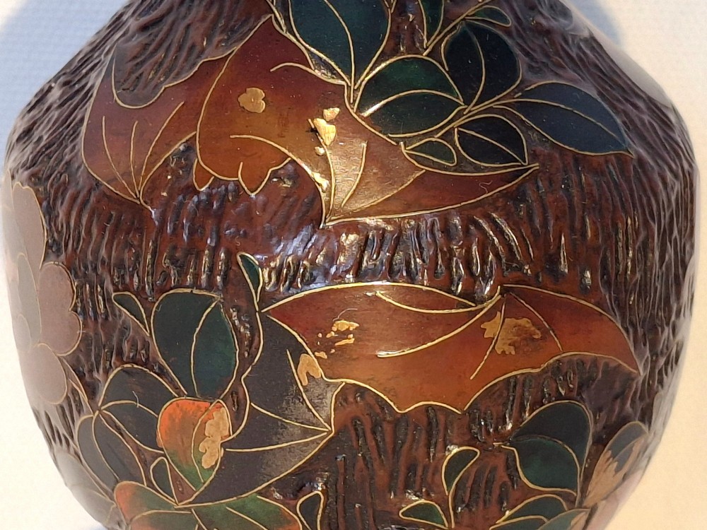 A dark brown Meiji period Japanese Totai Shippo ceramic vase displaying a textured tree bark surface decorated with cloisonne enamel bats and floral patterns. View II