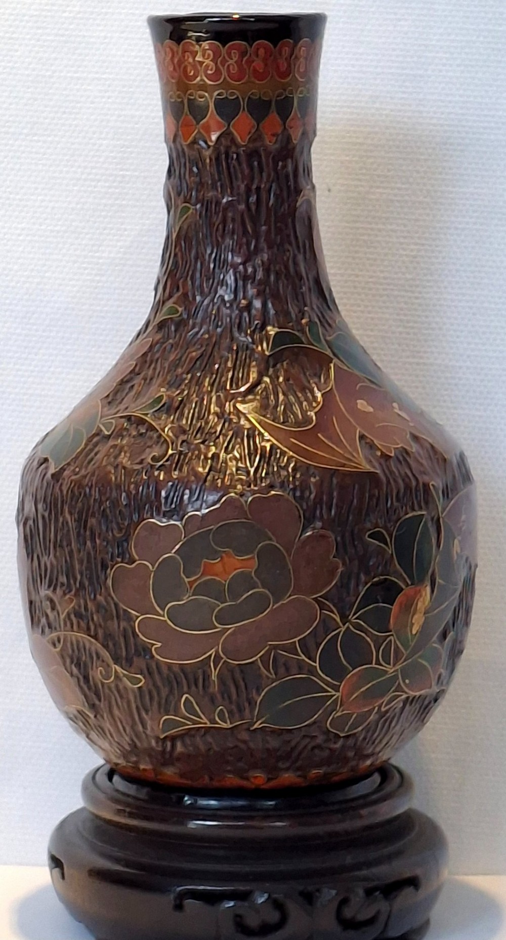 A dark brown Meiji period Japanese Totai Shippo ceramic vase displaying a textured tree bark surface decorated with cloisonne enamel bats and floral patterns. View III