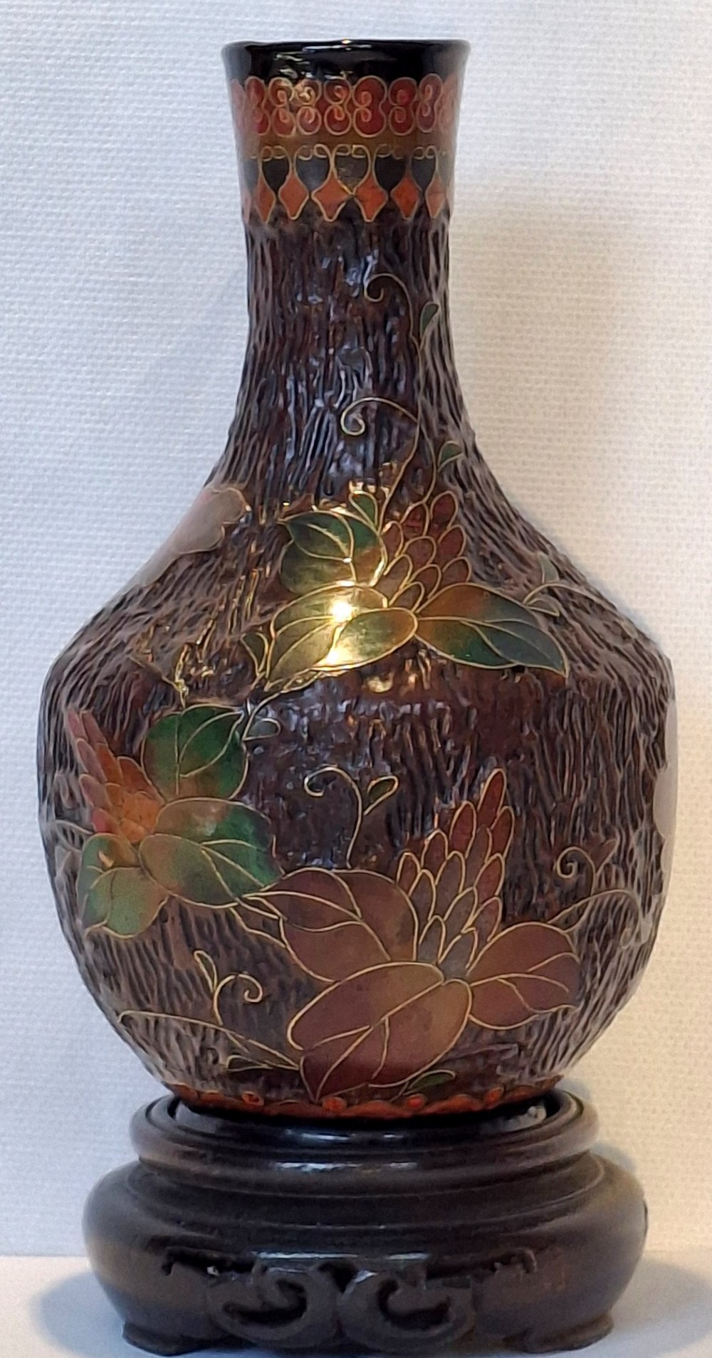 A dark brown Meiji period Japanese Totai Shippo ceramic vase displaying a textured tree bark surface decorated with cloisonne enamel bats and floral patterns. View IV