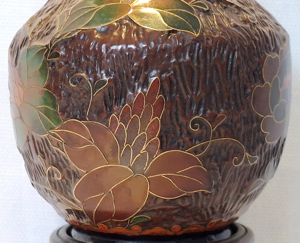 A dark brown Meiji period Japanese Totai Shippo ceramic vase displaying a textured tree bark surface decorated with cloisonne enamel bats and floral patterns. View VIII