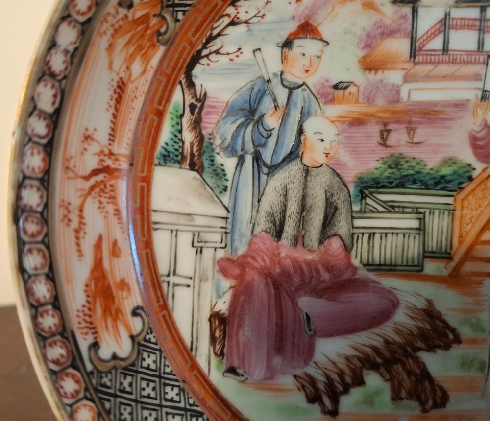 A hand-painted Chinese export porcelain coffee cup and matching saucer with polychrome figures and geometric diaper borders. View IV