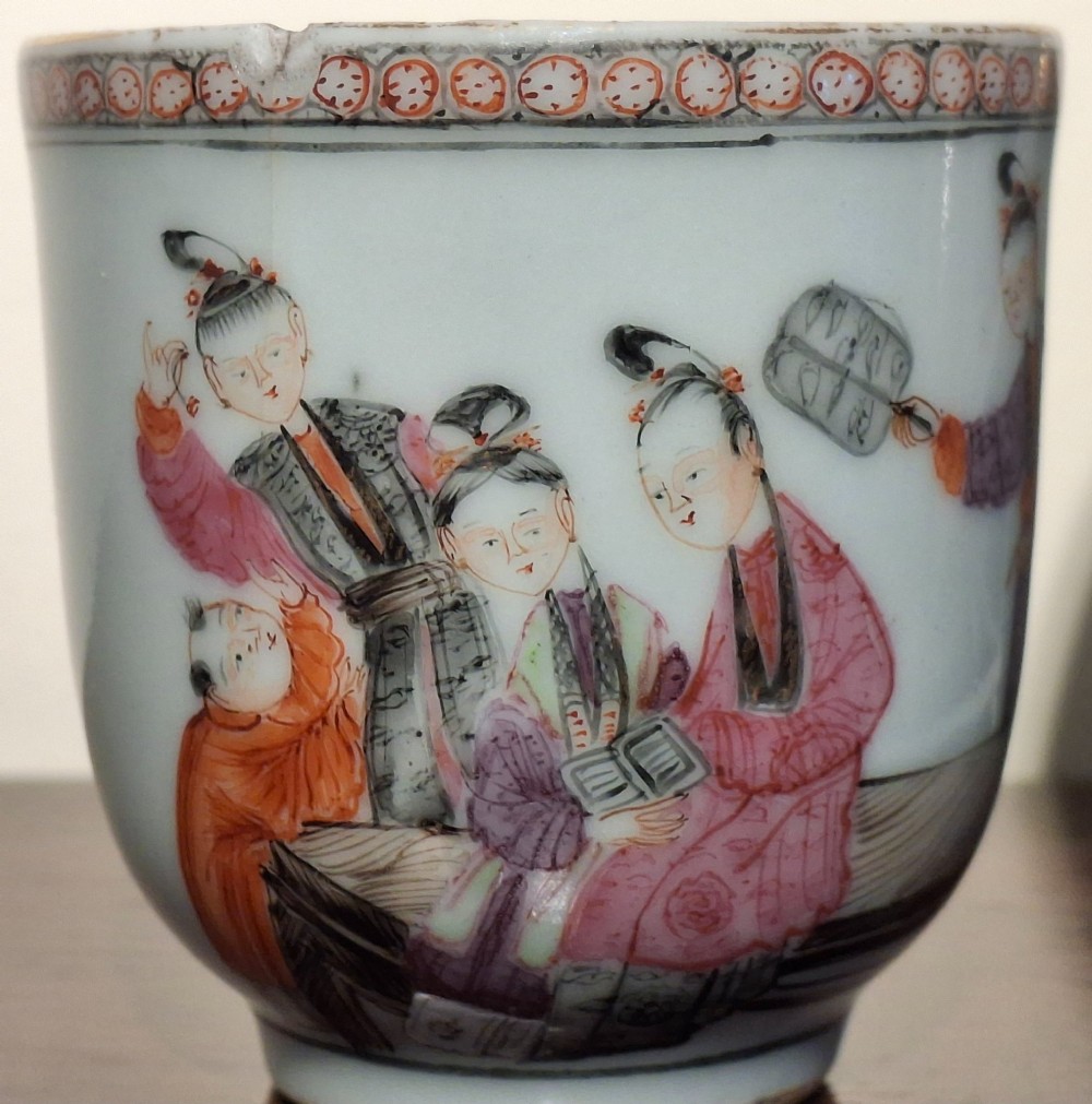 A hand-painted Chinese export porcelain coffee cup and matching saucer with polychrome figures and geometric diaper borders. View VIII