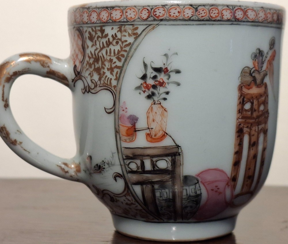 A hand-painted Chinese export porcelain coffee cup and matching saucer with polychrome figures and geometric diaper borders. View XI