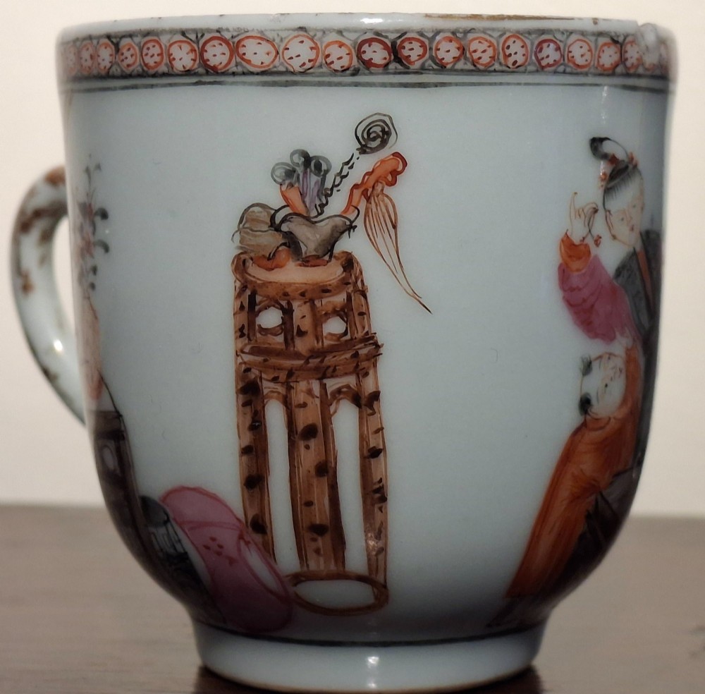A hand-painted Chinese export porcelain coffee cup and matching saucer with polychrome figures and geometric diaper borders. View XII