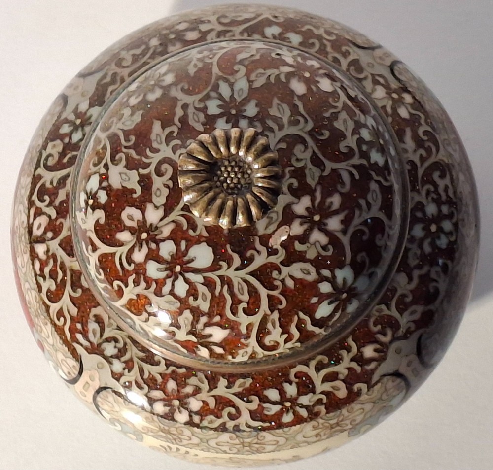 A Japanese cloisonne enamel koro decorated with phoenix motifs and intricate floral scrollwork, topped with a domed lid and carved finial. View XI